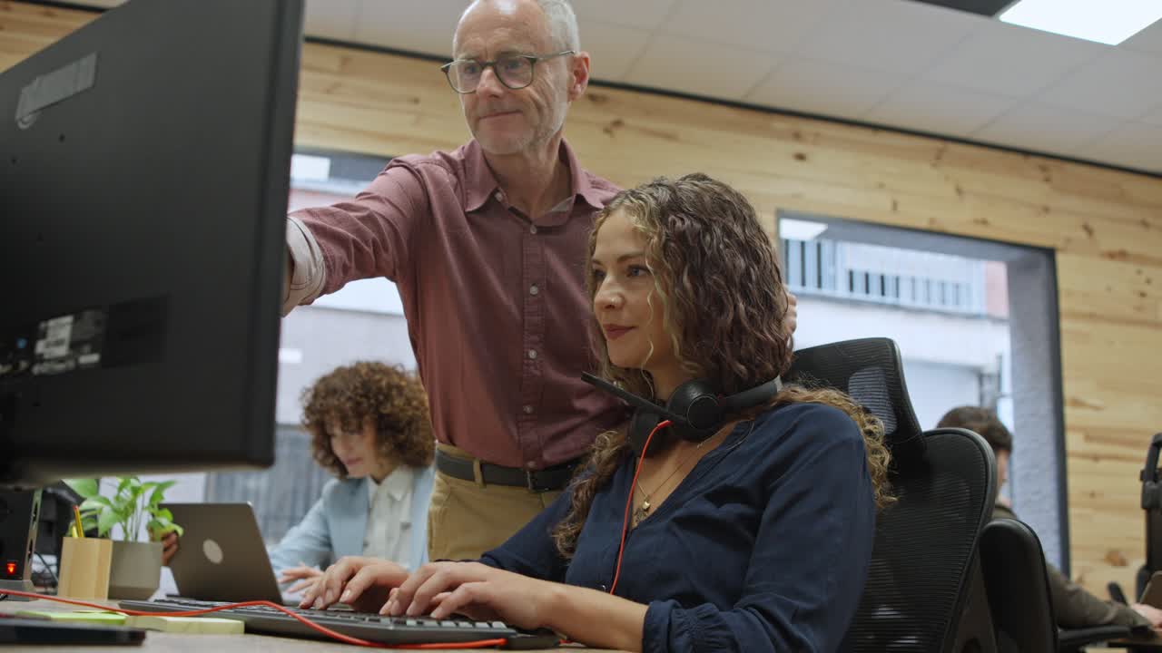 Office environment with coworkers collaborating