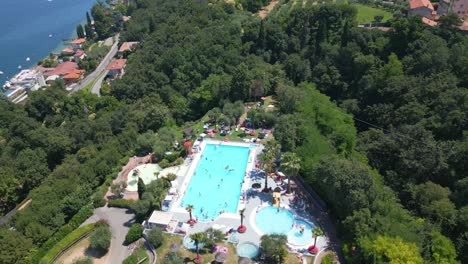 aerial shot of swimming pool at weekend glamping resort near lake garda, italy