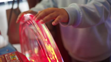 child playing a prize wheel game