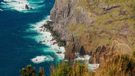 Slow-motion-wide-shot-of-rocky-coastline-from-high-viewpoint