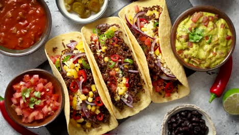 tasty mexican meat tacos served with various vegetables and salsa