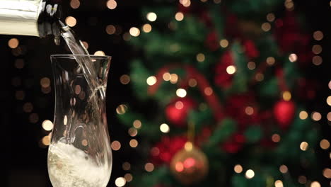 Pouring-champagne-in-flute-by-side-at-slow-motion