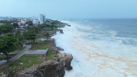 caribbean coastline slammed by violent sea waves, hurricane beryl, aerial