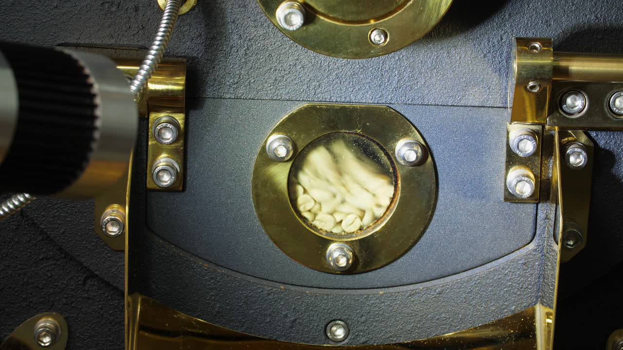 Raw Coffee Beans In A Modern Machine