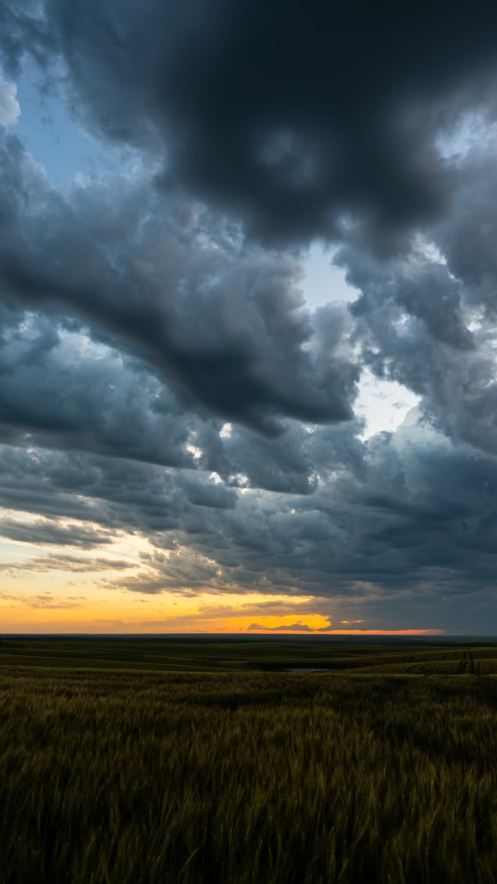 Golden sunset storm clouds creating colorful moody sky background with weather atmosphere and natural motion