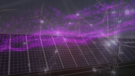 Animation-of-network-of-connections-and-glitter-over-wind-turbines-and-solar-panels