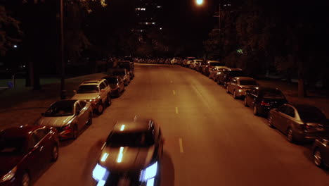 Car-is-driving-through-a-typical-American-suburban-neighborhood---Flyover-Shot