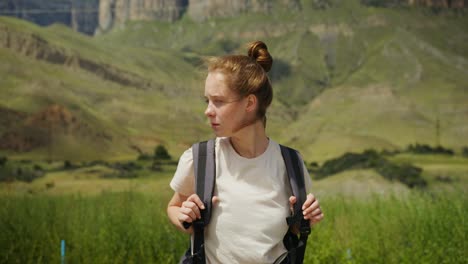 young woman hiking in mountains