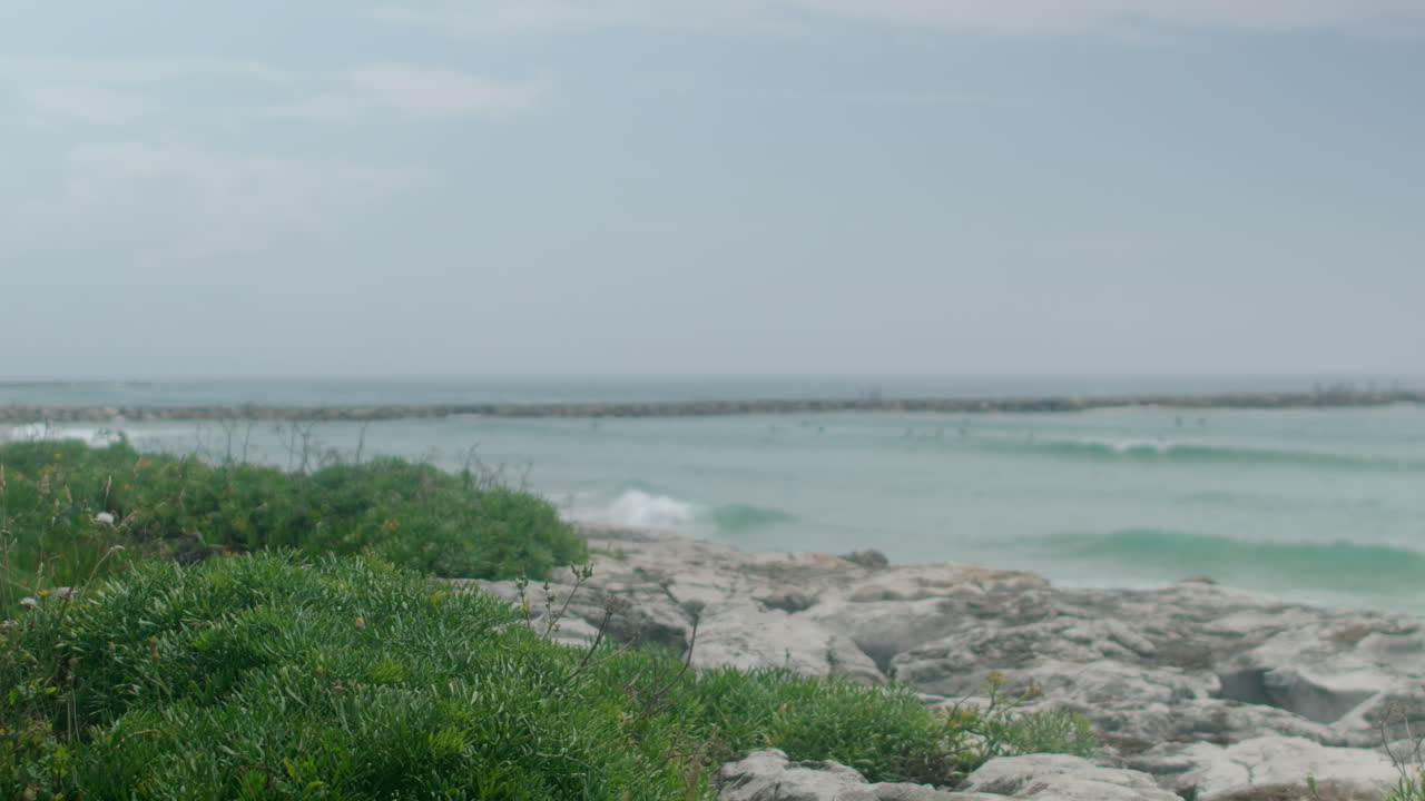 Waves rolling in by the coastline.