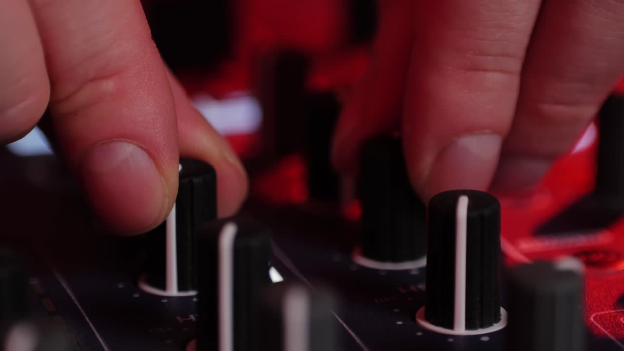 DJ Mixing on a Sound Board