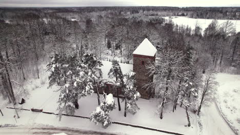 Old-stone-church-in-Latvian-country-side,-winter-time