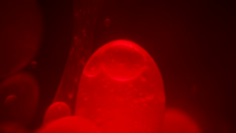 Close-up-macro-view-of-the-lava-balls-floating-inside-a-lava-lamp