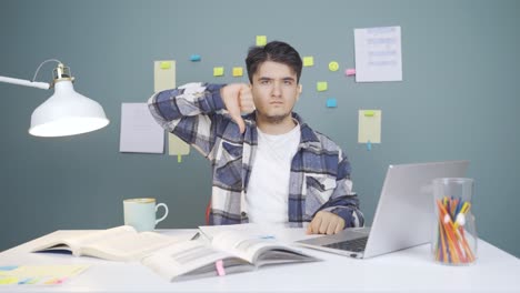 Male-student-looking-at-camera-with-negative-and-negative-gesture.