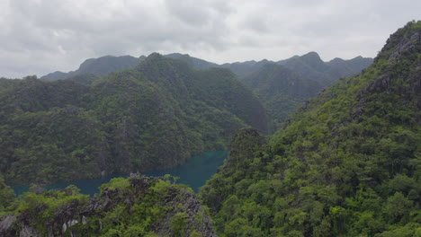 a drone video of a tropical setting over the ocean and jungle on an overcast day in the philippines-3