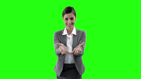 Businesswoman-gesturing-against-green-screen