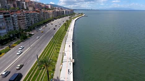 aerial view traffic at coast line road on a sunny bright day.aerial view above the coastal highway.