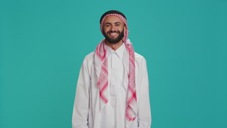 muslim guy nodding in studio shot