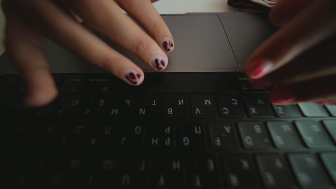 Young Girl's Hands Typing and Using Trackpad on Laptop