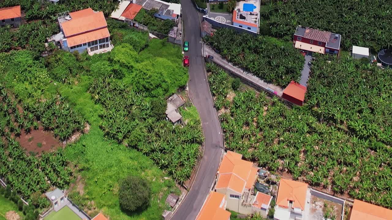 Explore the scenic drone view of Madeira's lush countryside and homes