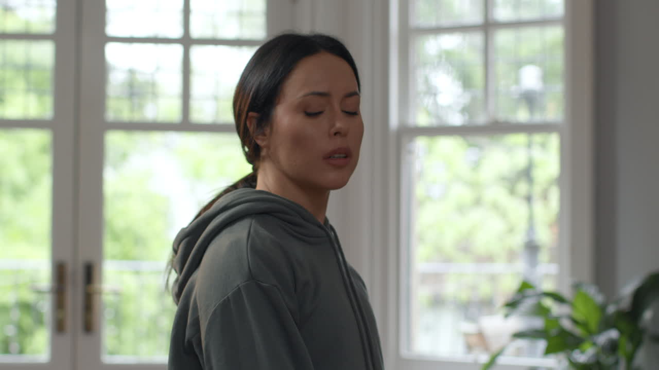 Stressed And Tense Woman With Problems And Financial Worries About Cost Of Living Crisis Debt And Paying Bills Pacing At Home