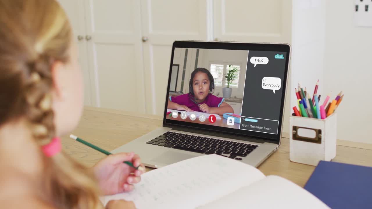 Composite video of girl using laptop for online lesson at home, with diverse schoolgirl on screen