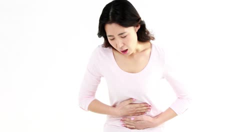 pretty asian woman with stomach ache