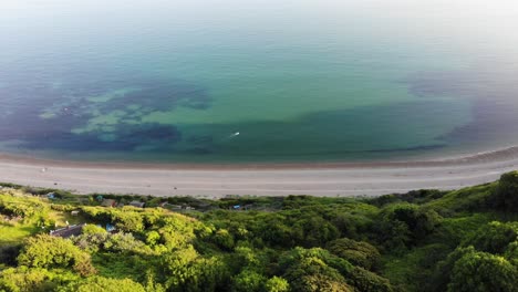 aerial looking down littlecombe shoot beach coastline from cliff