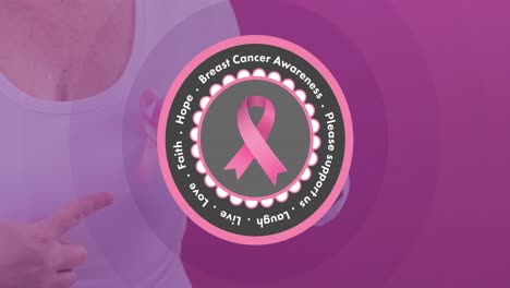 Video-of-breast-cancer-awareness-logo-over-caucasian-woman-wearing-pink-cancer-awareness-ribbon