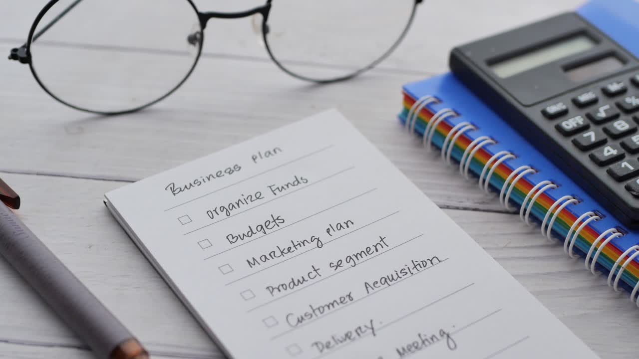 Tick mark on planning goals on notepad ,