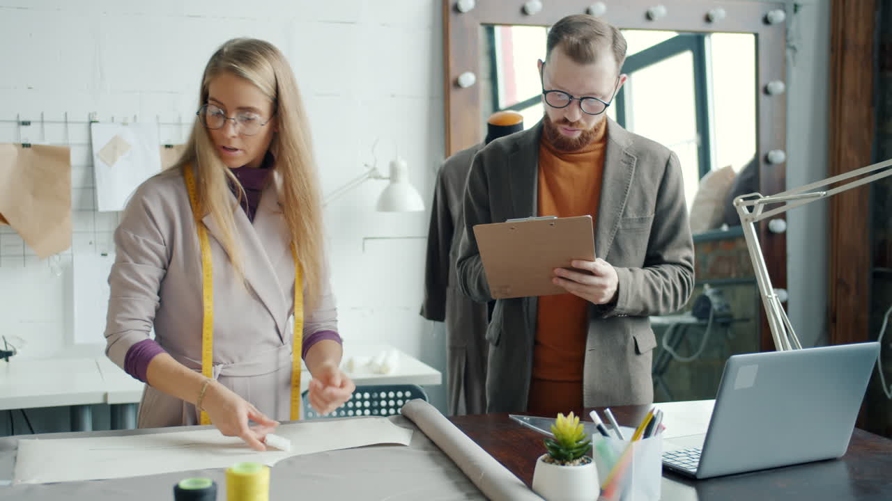 Fashion Designers Collaborating in a Design Studio