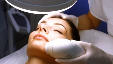 doctor giving facial massage through soniclifting