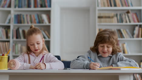children studying in a library