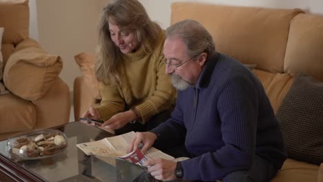 aged couple with map planning tourist route