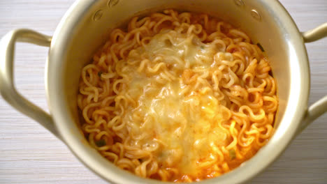 korean spicy instant noodle bowl with mozzarella cheese