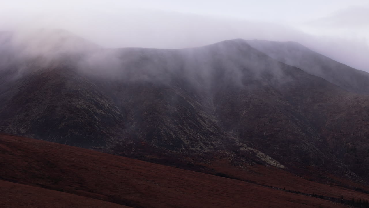 Ogilvie Mountains On A Misty Day In Yukon, Canada - Drone Shot