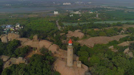 Light-house-of-mamallapuram-situated-among-famous-Rock-cut-Pallava-era-temples,-aerial-view-shot-on-Phantom-4-pro-4K-drone