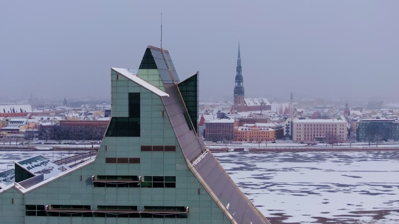Aerial orbit unveils winter Riga skyline, iconic churches and frozen Daugava