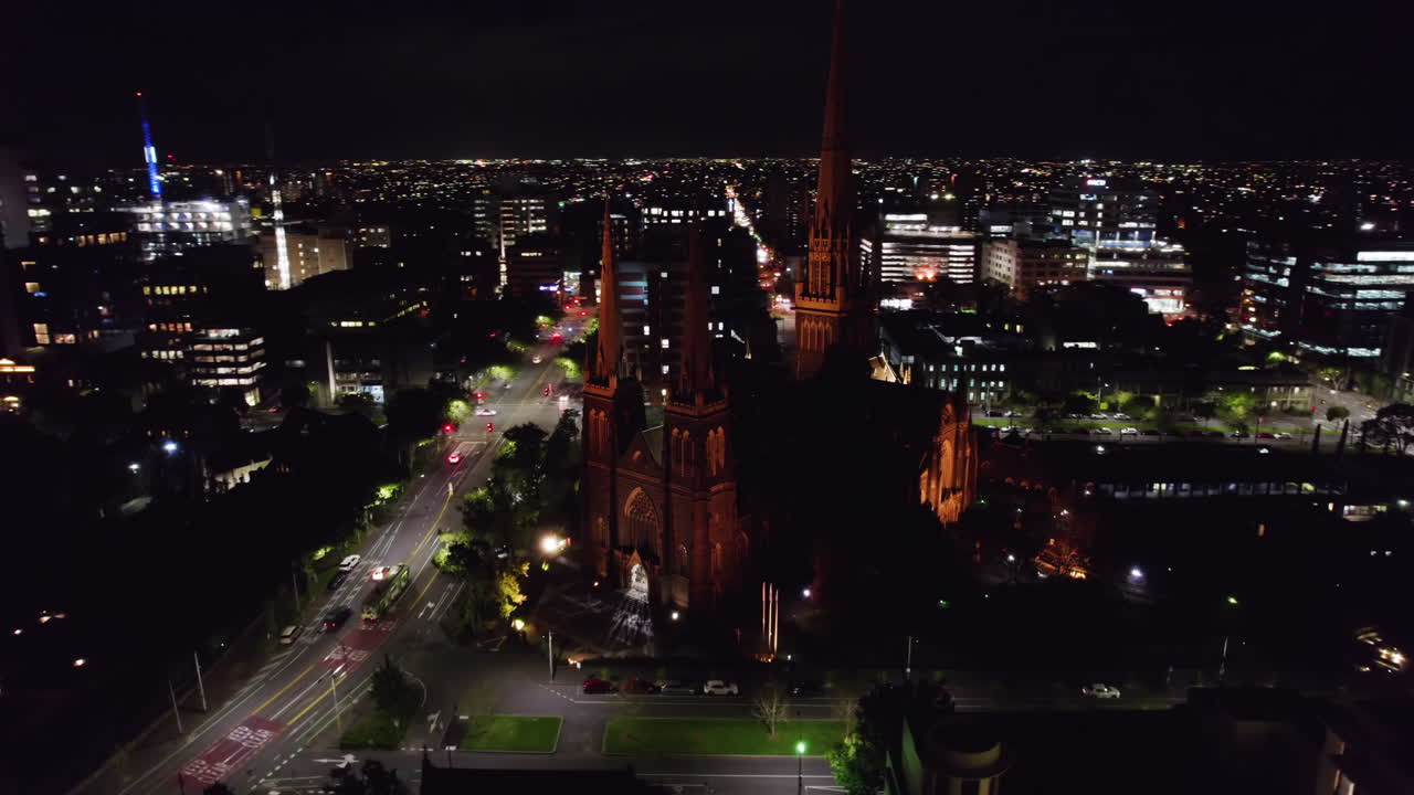 Aerial Night View of a City with a Cathedral