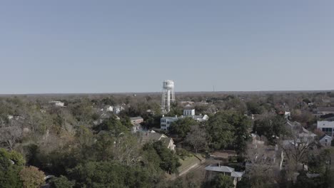 Wide-aerial-shot-flying-over-the-Natchez-Watertower-in-Mississippi