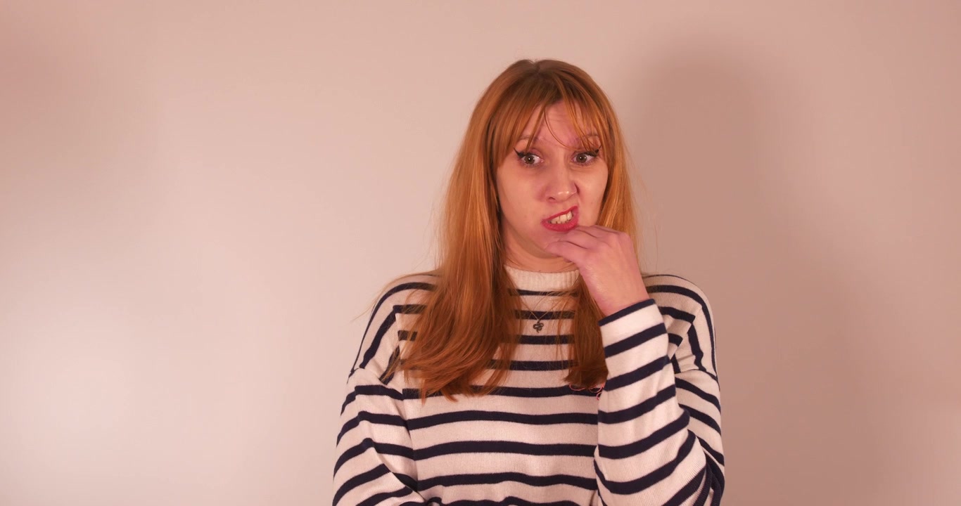 Beautiful girl dramatizing and making faces expressing disgust and pitty