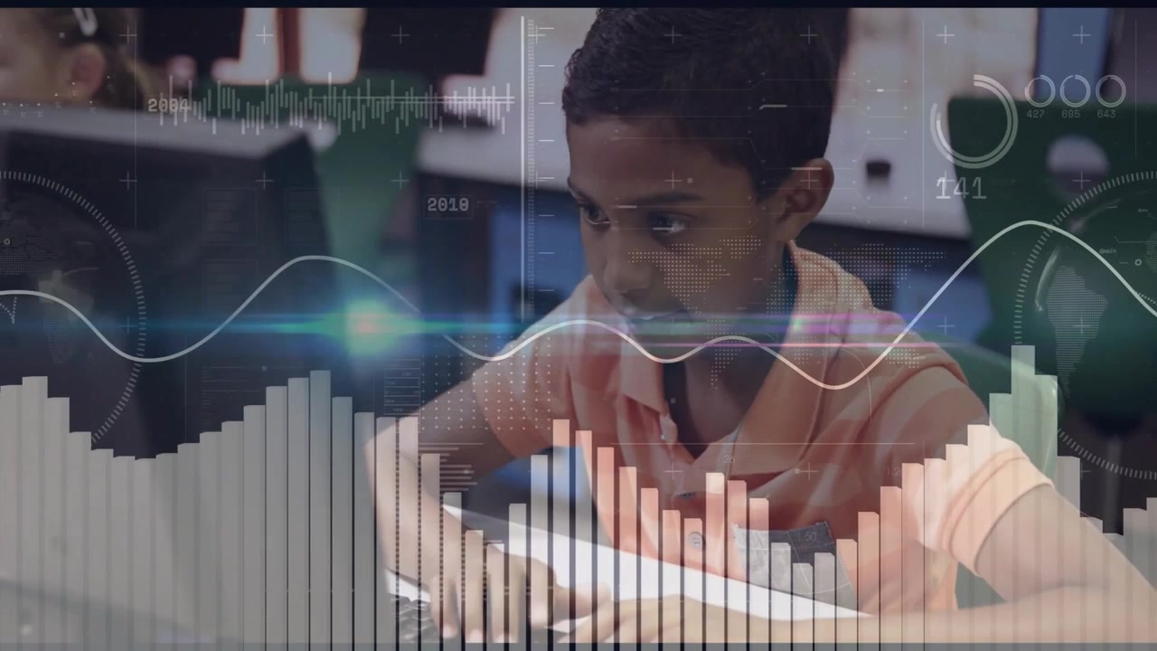 school-age boy typing on keyboard in lab activating data-visualization overlays for education