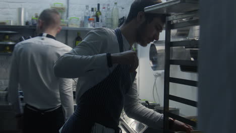two chefs working in a restaurant kitchen