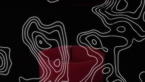 composición digital del patrón de topografía sobre una vela encendida contra un fondo negro