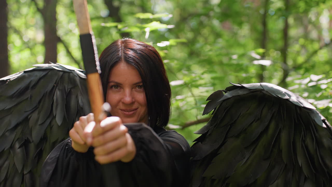 Beloved of Eros with black wings aims bow in green forest, sunlight glimmering through leaves, calm expression filled with focus and elegance, mystical fantasy moment blending divine beauty