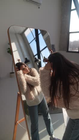 woman getting ready in front of a mirror