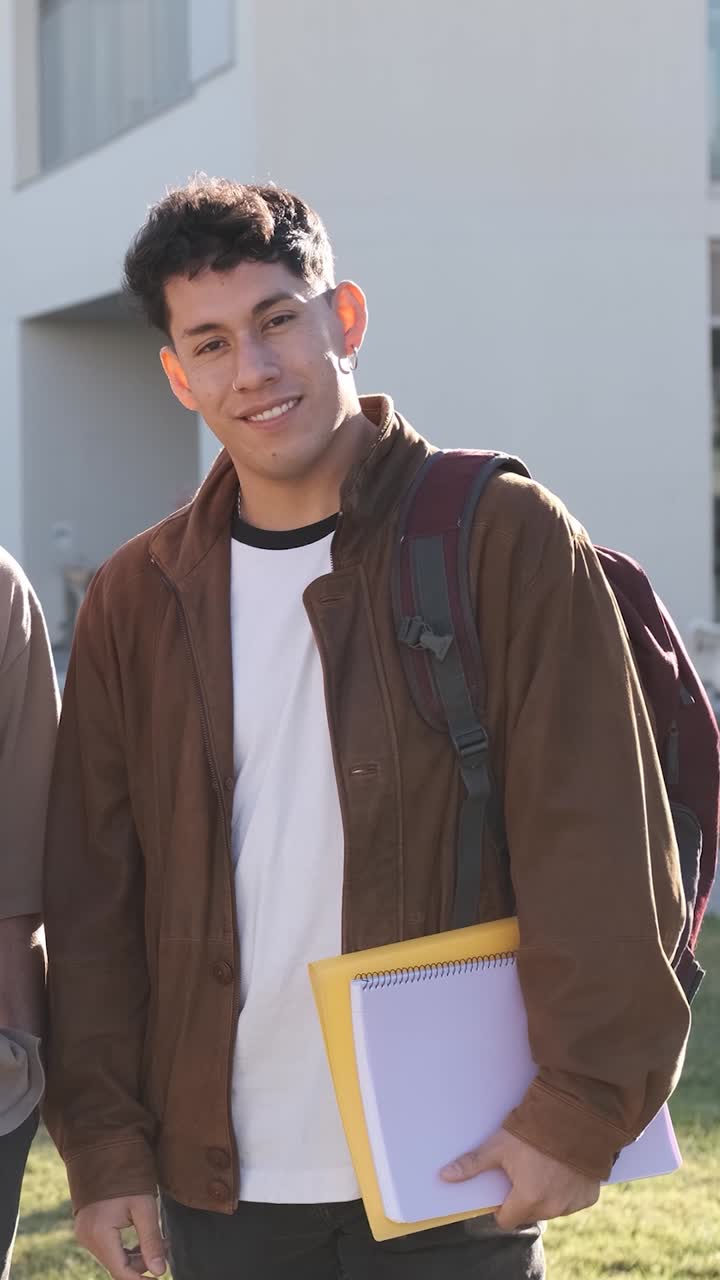 One student looking at the camera standing in the campus