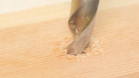 horizontal video of a wet drill making holes in a wooden surface with shavings horizontal video of a wet drill making holes in a wooden surface with shavings industrial production of wooden products