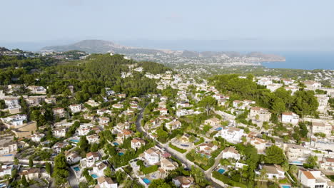 aerial view of a mediterranean coastal town with villas