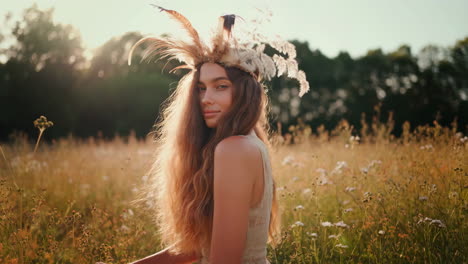 bohemian woman in a golden field at sunset