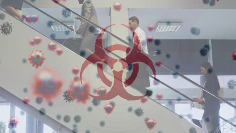 animation of biohazard symbol and floating covid-19 cells over people walking at airport